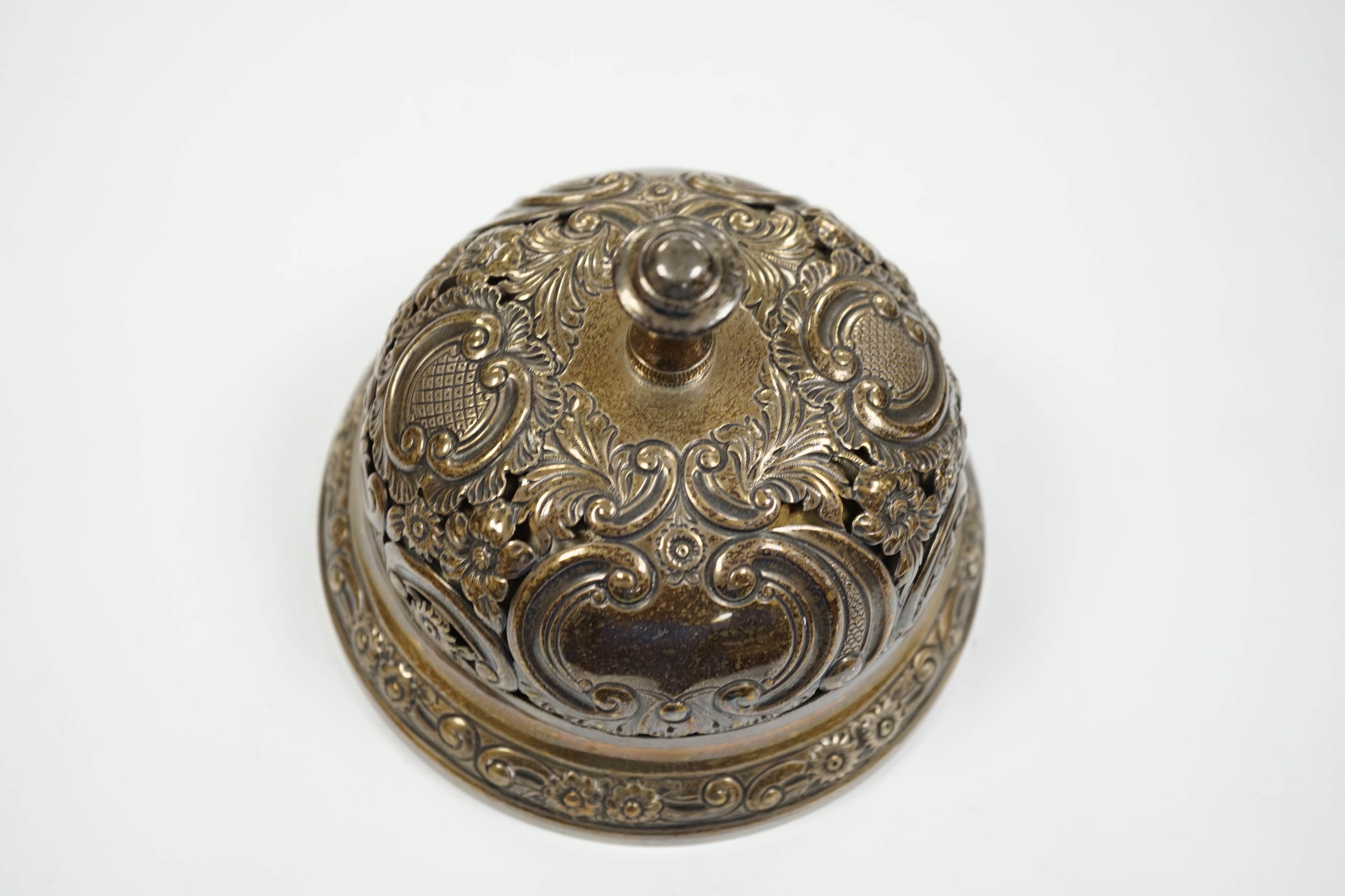 A late Victorian pierced silver mounted table bell, Samuel Walton Smith, Birmingham, 1894, base diameter 13.2cm.